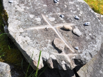 A single cross is worn into the large capstone on St Gobnait’s Grave; the grave is a station on the turas which is circled several times and stopped at for prayer.